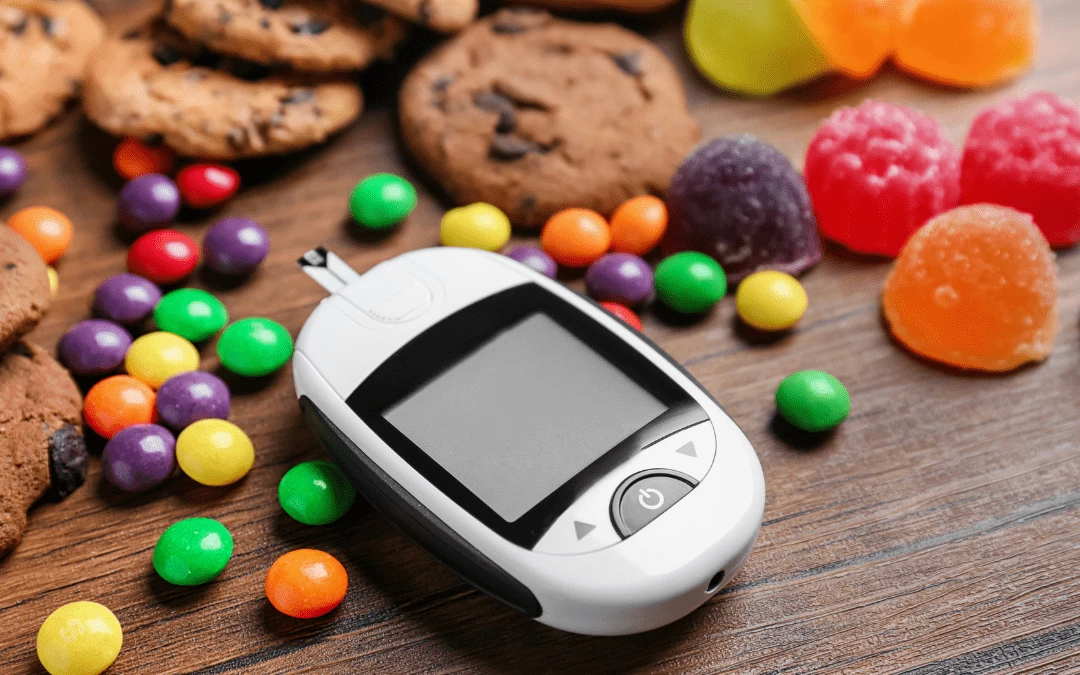 Glucometer On The Table With Sweets And Chocolate Together