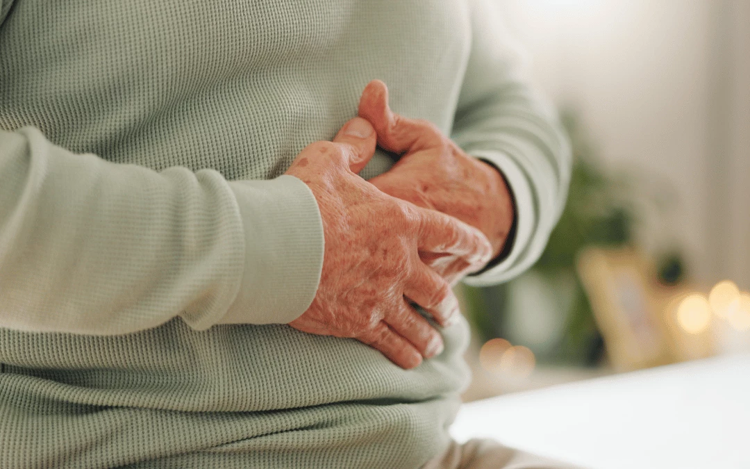 closeup-of-senior-man-putting-his-hand-on-stomach-indicating-indigestion-stomach-discomfort